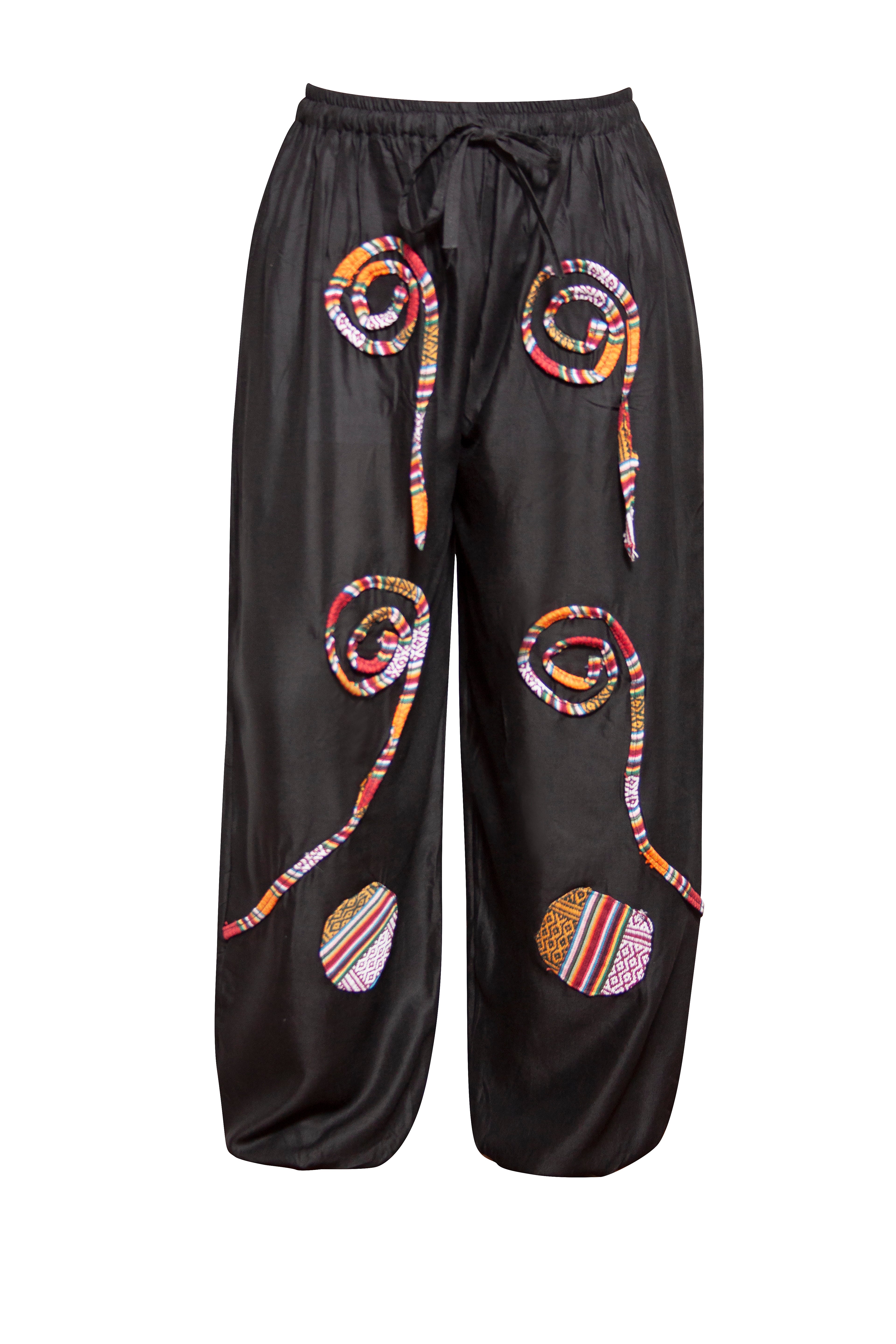 Black pants with colorful spiral patterns on a white background